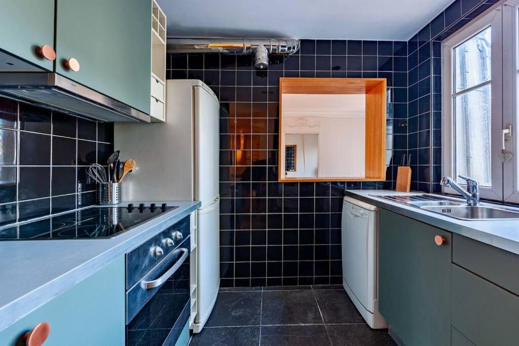 Charmant Appartement Au Coeur De Paris Bagian luar foto
